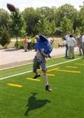 Playing football on the field at Bloomingdale Park
