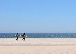 Surfers on Rockaway Beach.