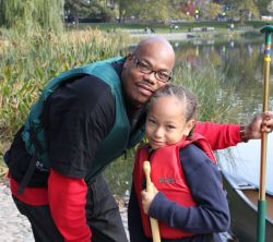 Darryl Harris and his son prepare to canoe on the Harlem Meer on October 24.