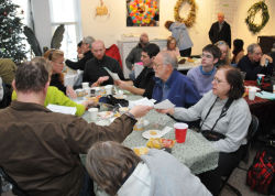 Volunteers gather in the Arsenal Gallery on Sunday