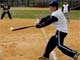 Baseball player hits ball