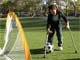 Young athlete with crutches playing soccer