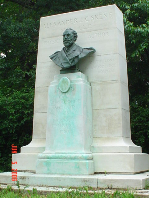 Bust with integral standard on pedestal backed by a stele