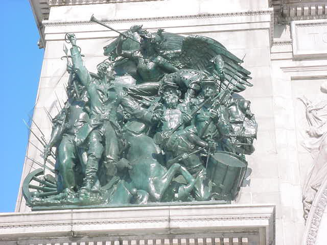 Group in high relief on platform