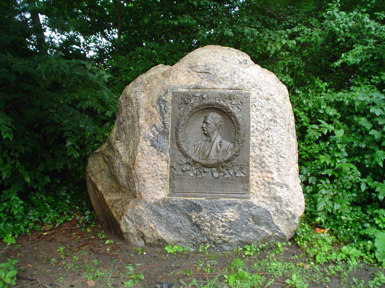 Plaque with bas-relief roundel on boulder. Replica of original which is now at the Brooklyn Museum