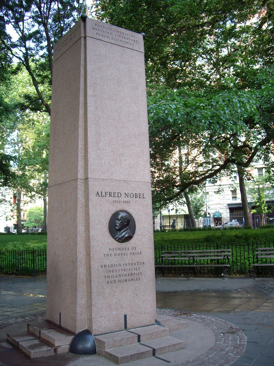 Retangular four-sided stele with attached bronze medallion; engraved with names of American laureates