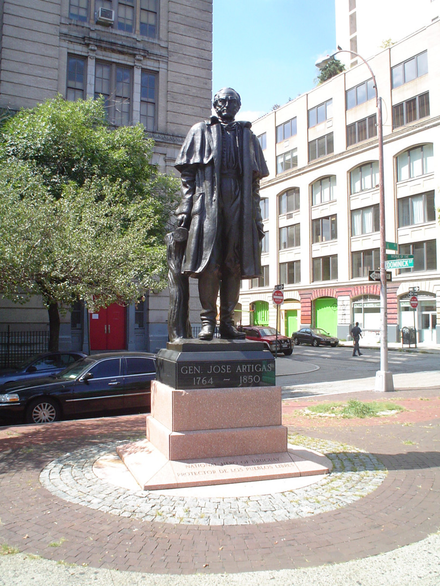 Standing figure (heroic scale), integral plinth, pedestal, plaque in rear