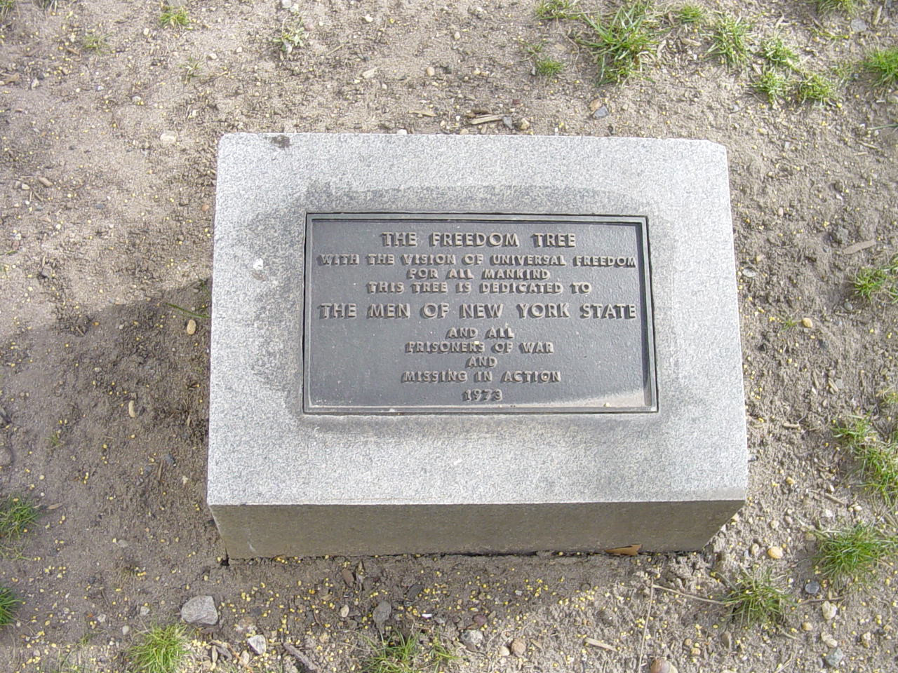 Plaque on plinth, set into ground