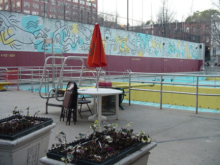 Mural on rear of concrete handball wall, facing outdoor pool