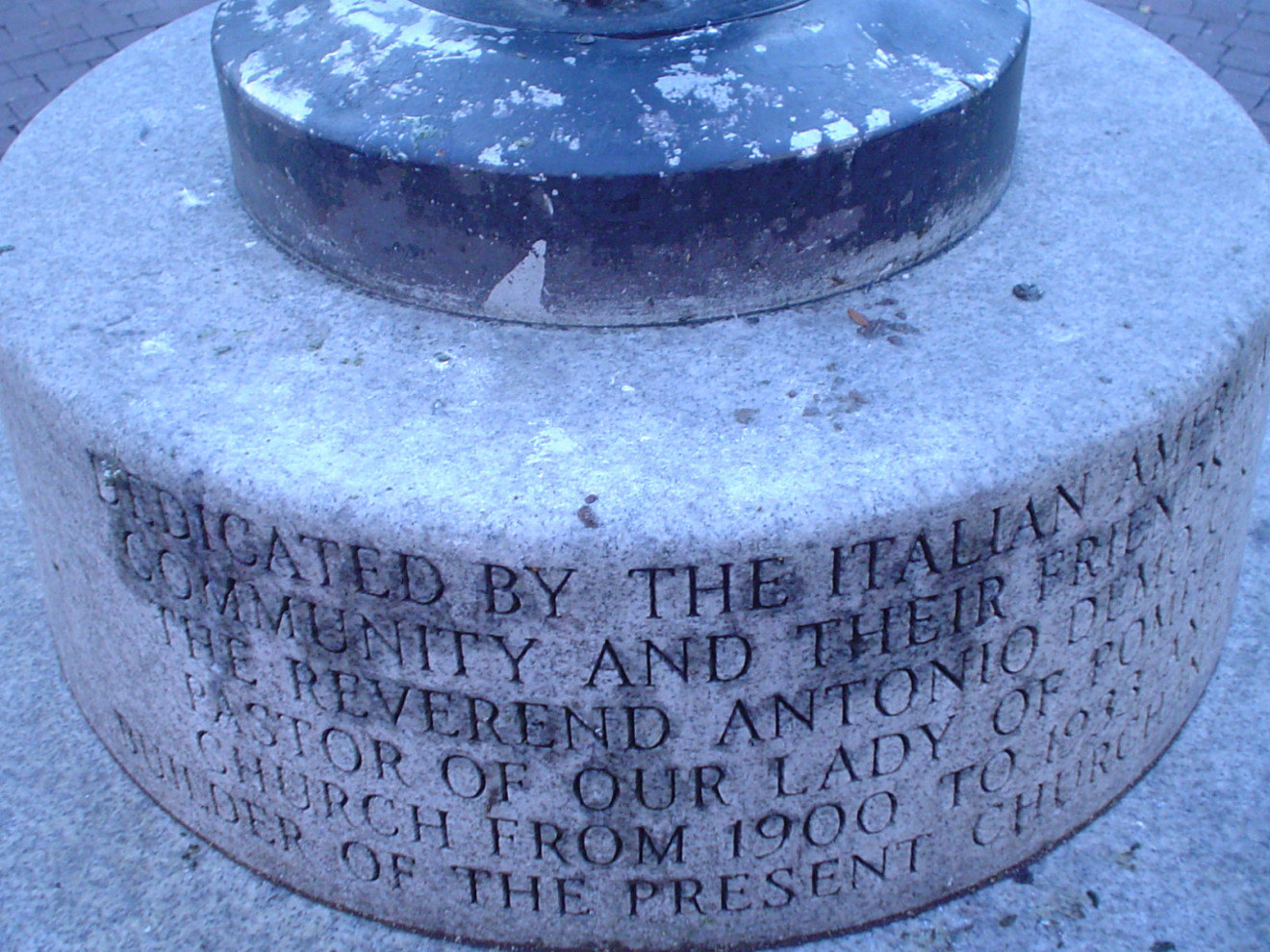 Incised letter on light pole base