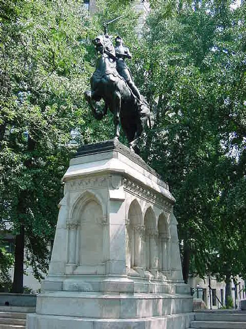 Equestrian figure (over life-size) on integral plinth on pedestal