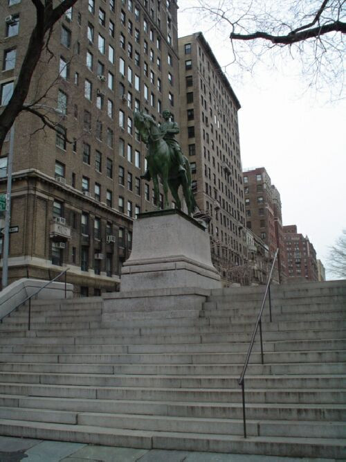 Equestrian figure (over life-size) with integral plinth on a pedestal that rests on a base that allows the monument to sit at the top of a staircase