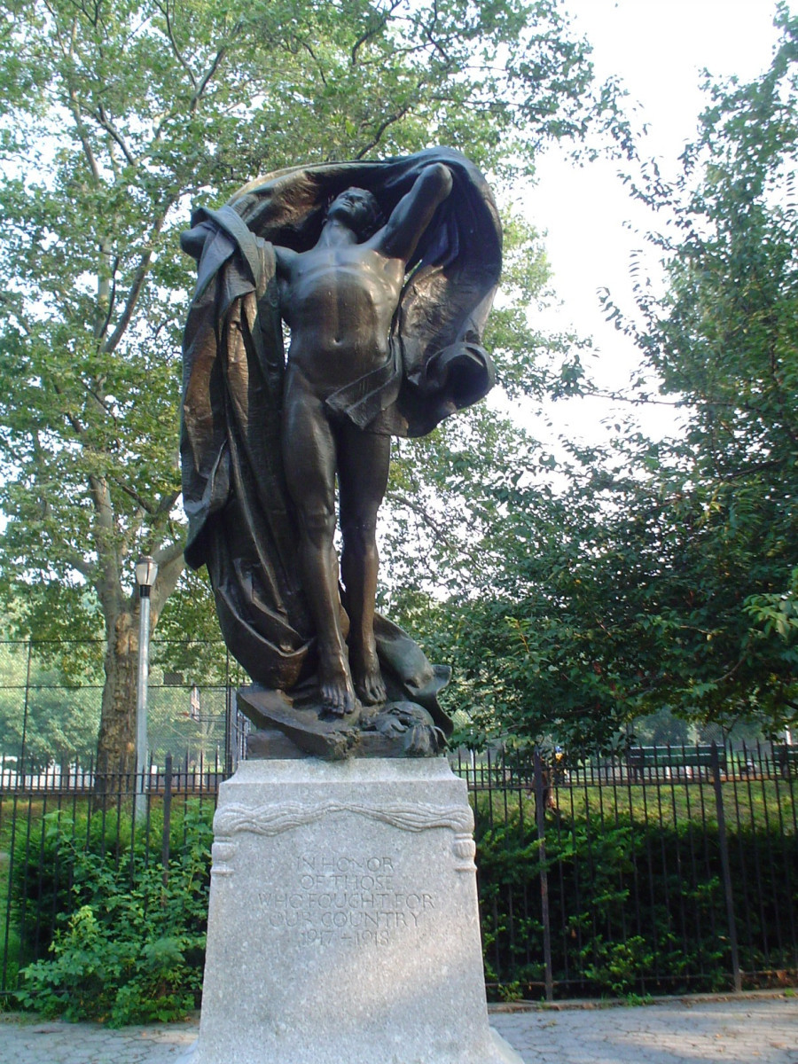 Standing male figure (heroic scale) with integral plinth on pedestal raised on three steps, tablet