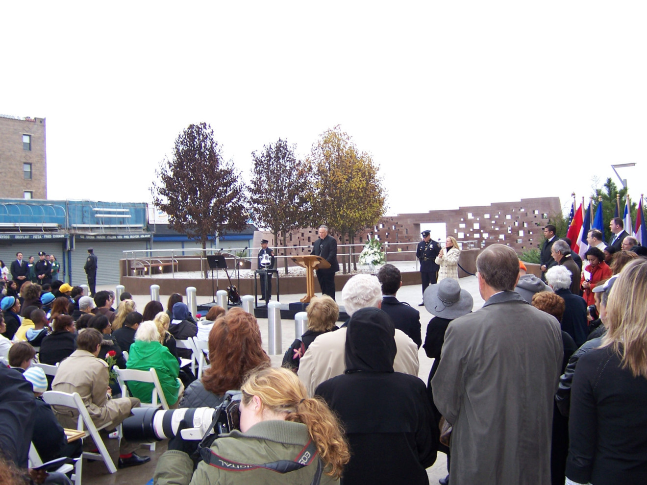 Commemorative wall with inscribed names; plaza