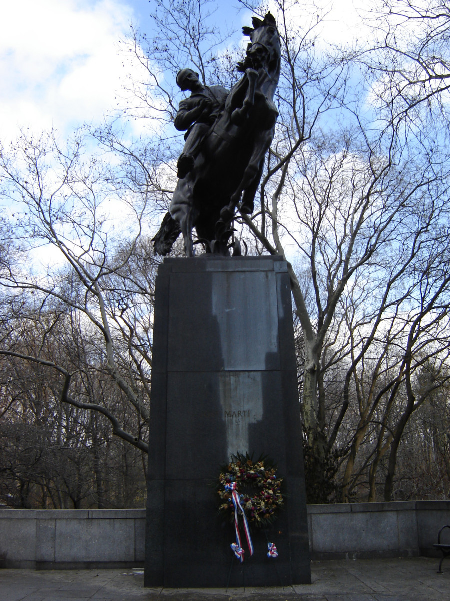 Equestrian statue (over life-size) on integral plinth on pedestal