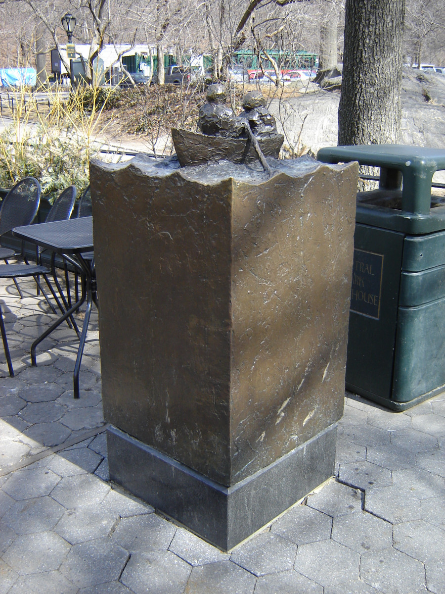 Group of two figures on integral plinth on pedestal, with plaque