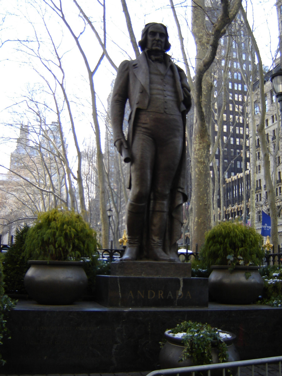 Standing figure (heroic scale) with integral plinth on pedestal on base decorated with applied medallion