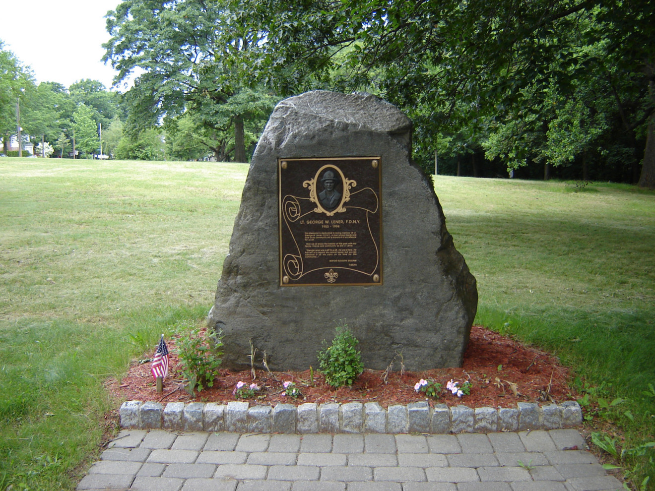 Relief plaque mounted on boulder