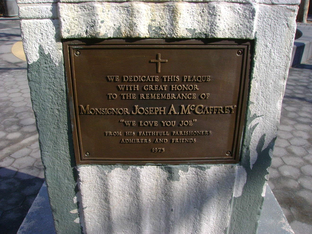 Plaque embedded in flagstaff base