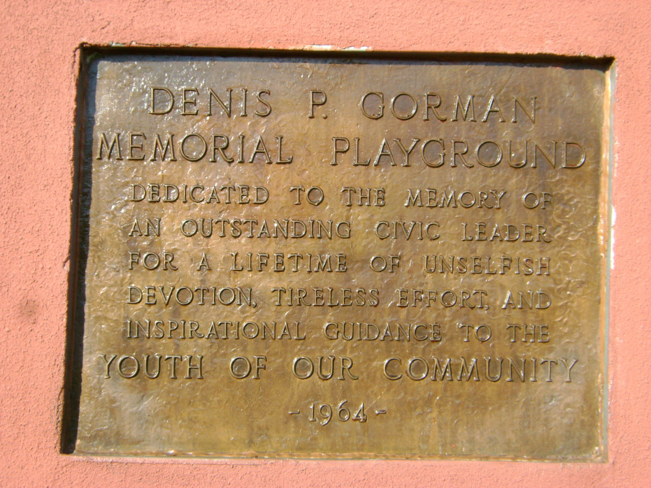 Plaque on field house wall