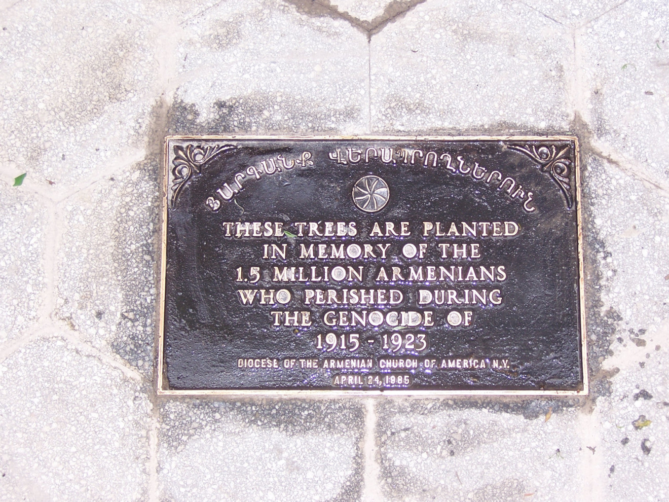 Plaque set in ground