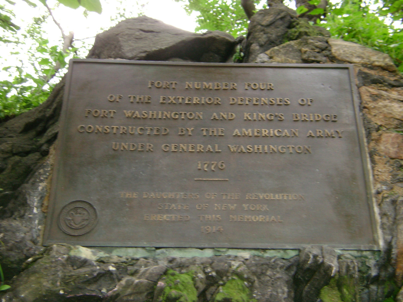 Tablet recessed in stone wall