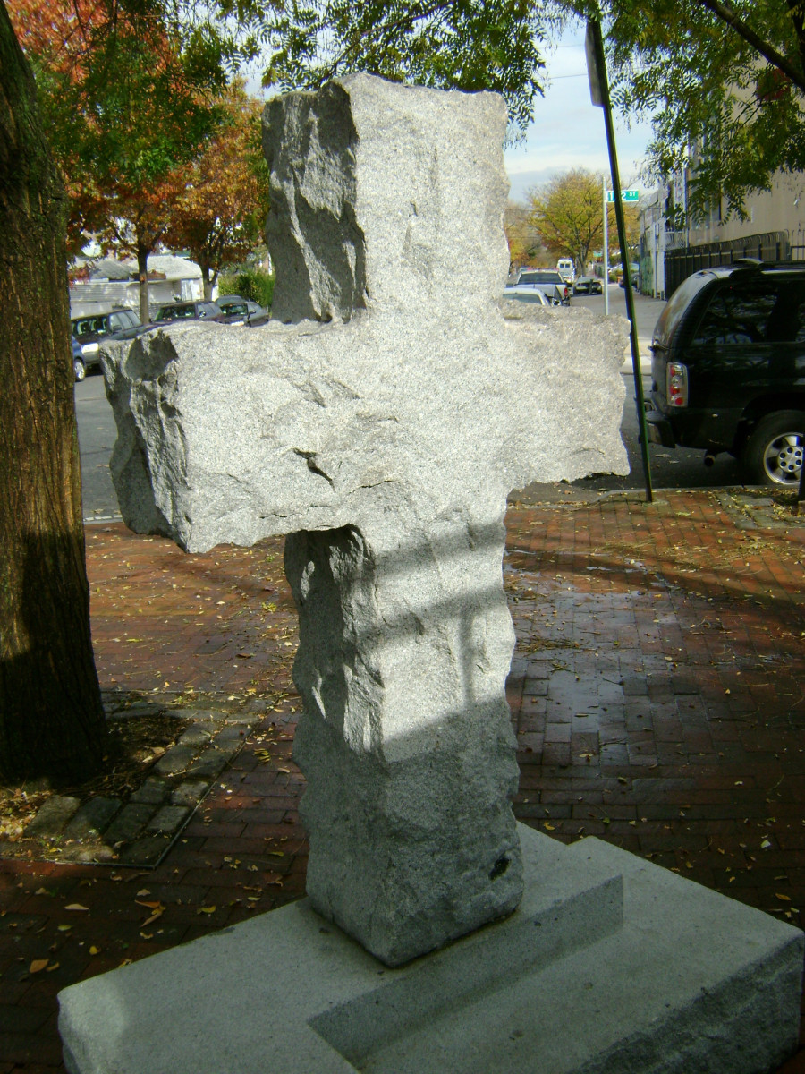 Carved cross on base