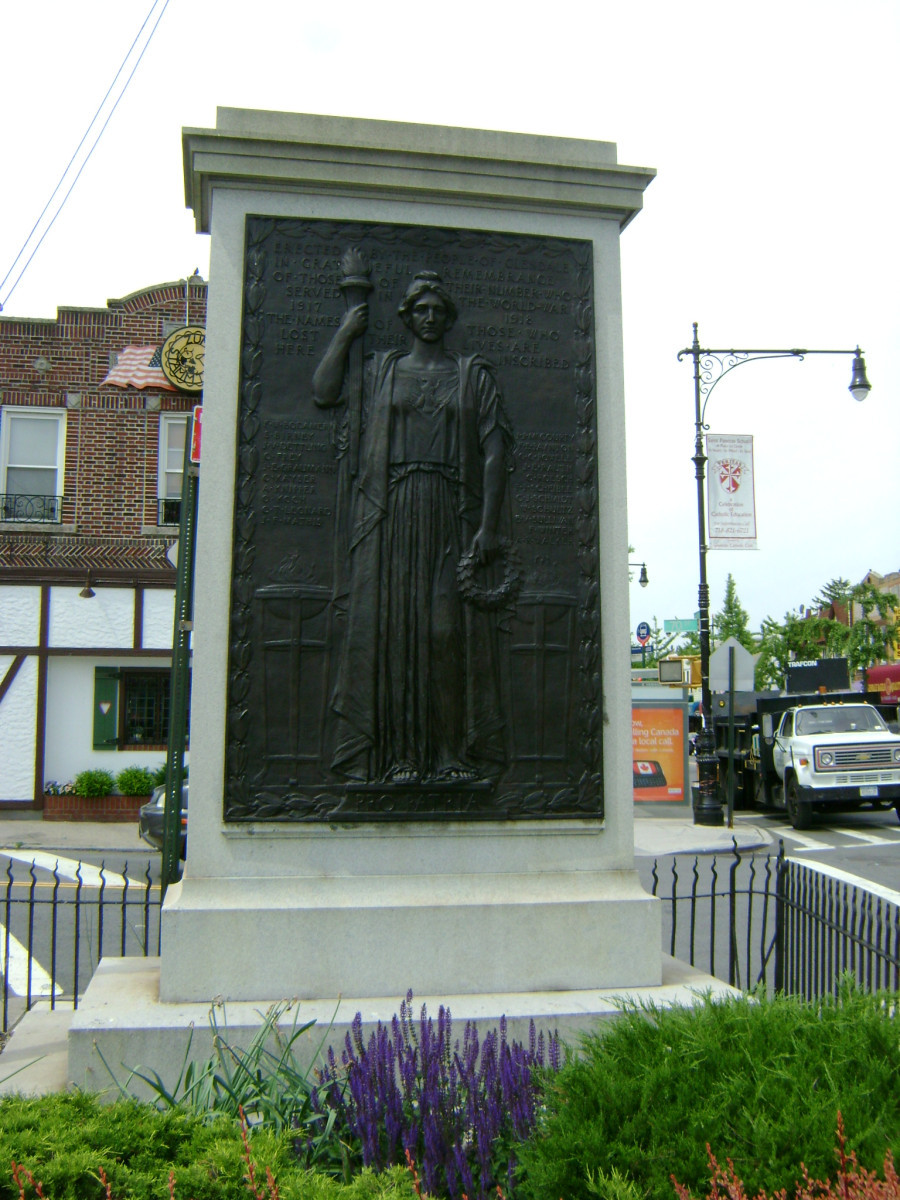 Plaque with bas-relief of female figure holding a torch aloft in her right hand over a list of twenty-one names, on a stele