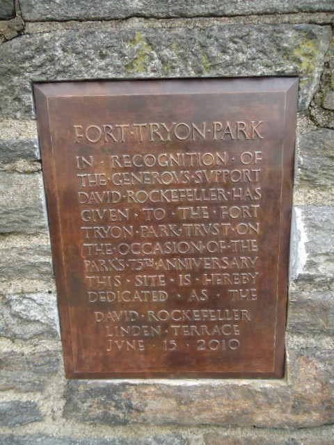 Dedication plaque inset into fieldstone wall