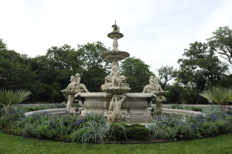 Three-tiered, octagonal fountain with extensive sculptural program of sea creatures, etc.