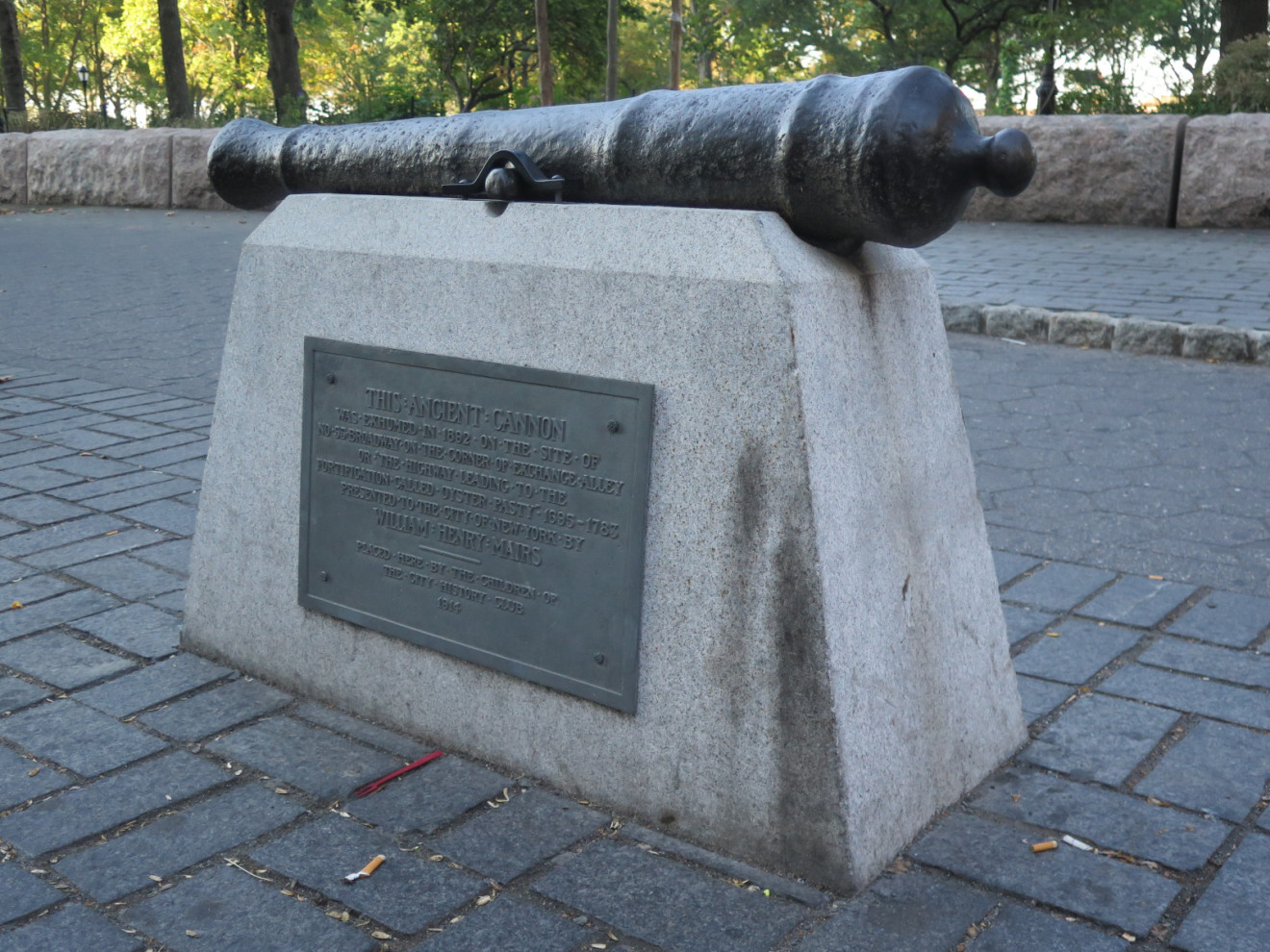 Cannon on base, plaque