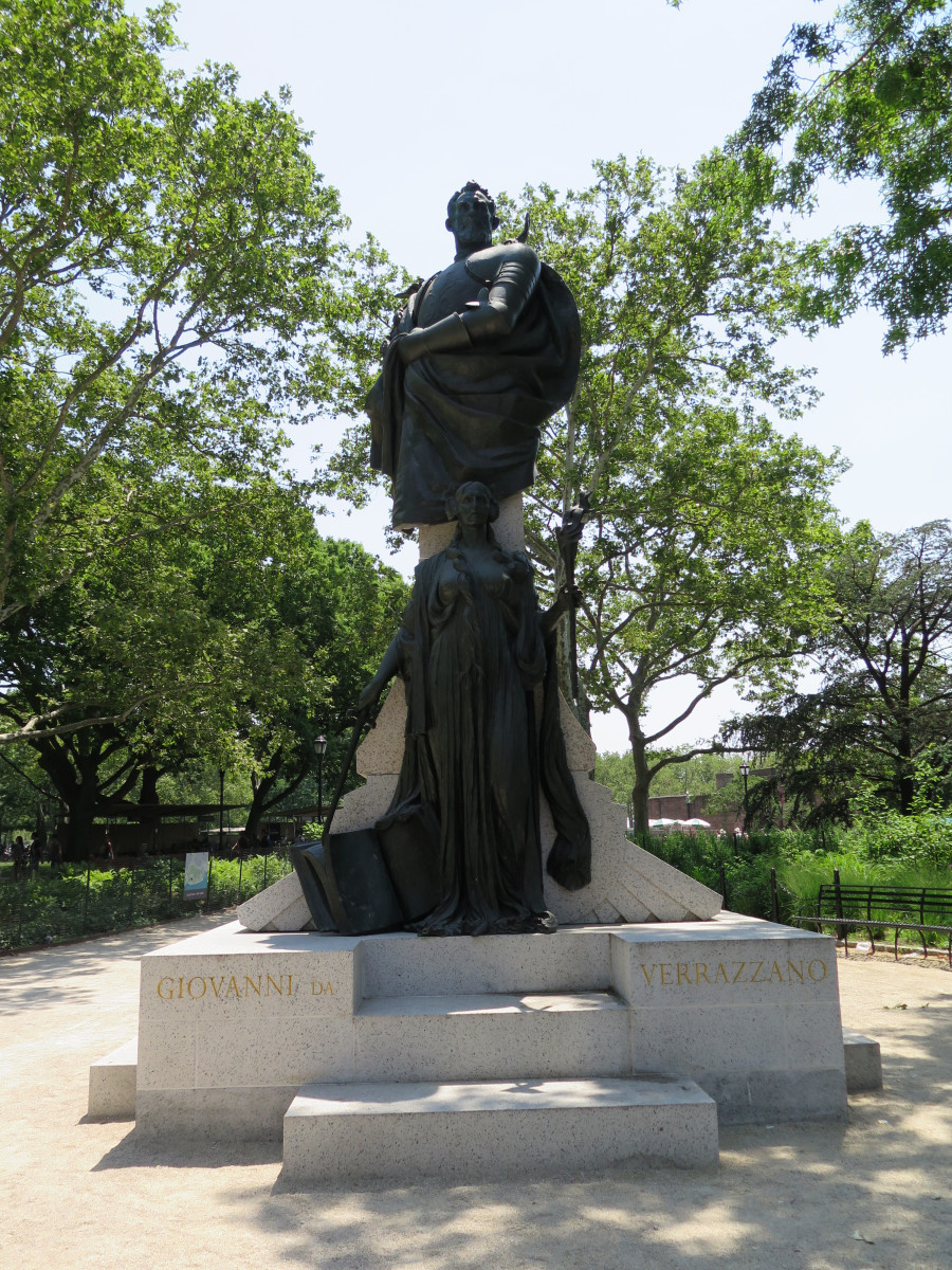 Elevated male half figure and standing female figure (both heroic scale) on pedestal consisting of two perpendicular slabs