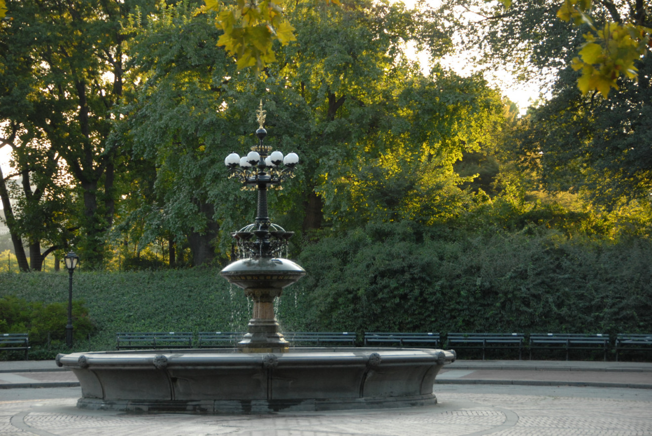 fountain with bronze and wrought iron finial on top a polychrome masonry base