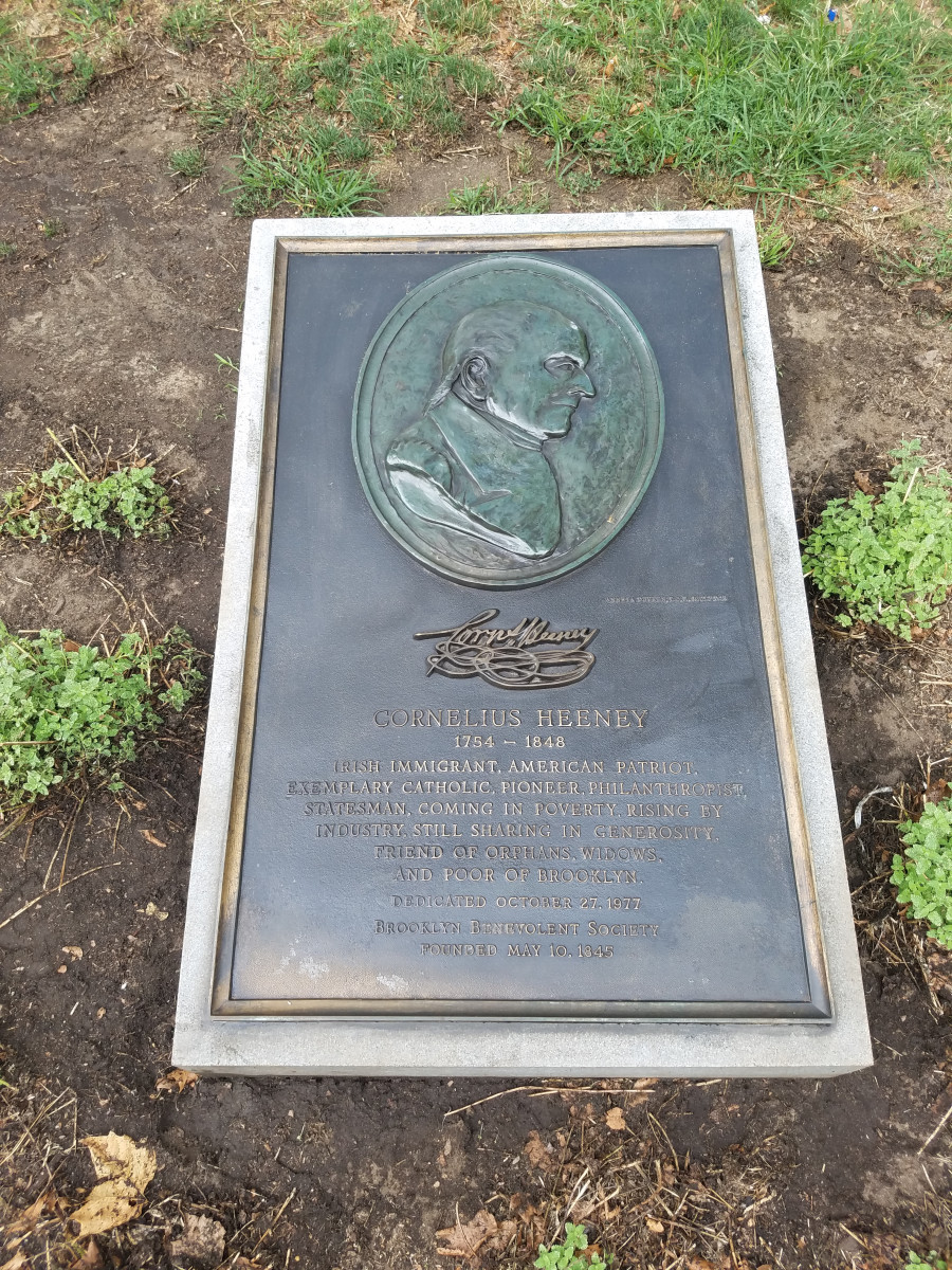 Plaque with relief medallion on plinth