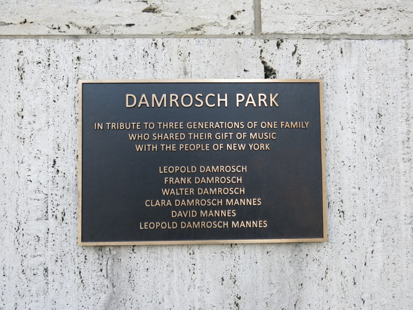 Bronze Plaque affixed to a wall