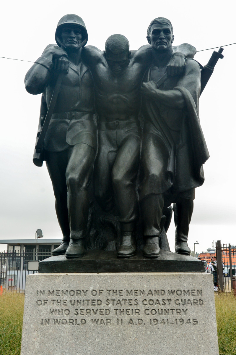 Group of three figures (heroic scale), integral plinth, on pedestal