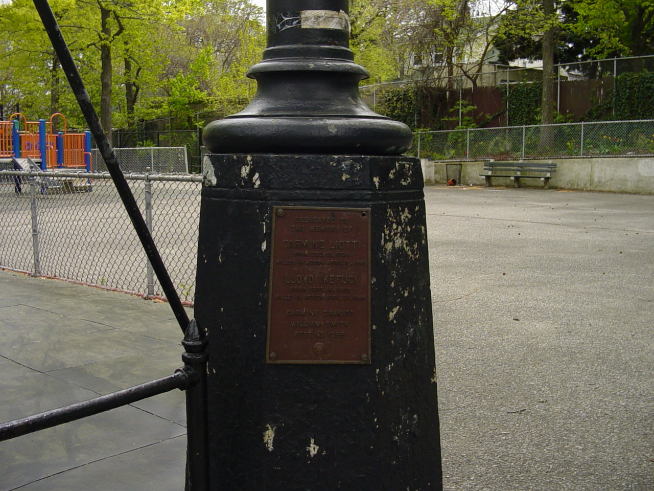 Plaque mounted on flagpole plinth