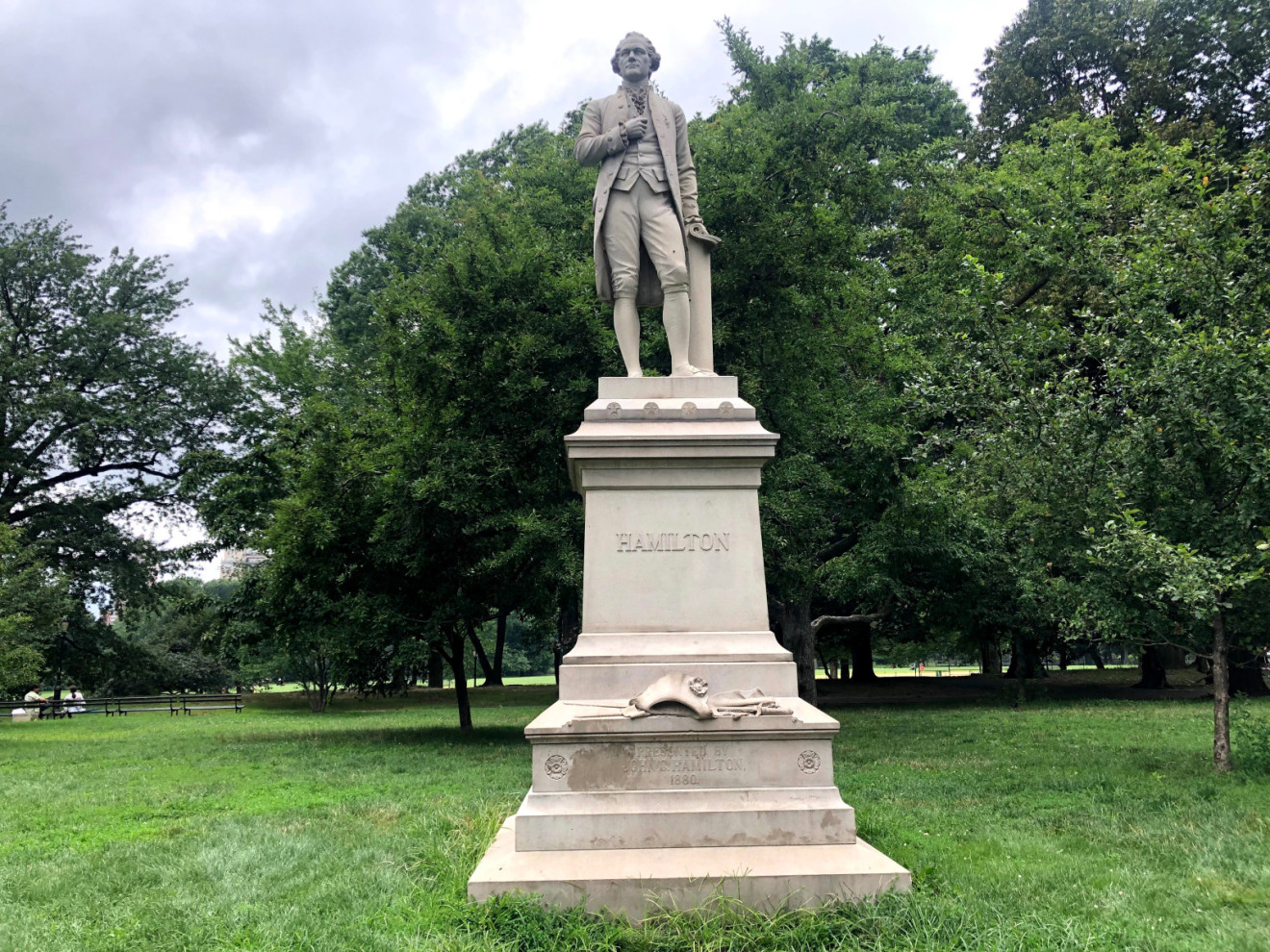 Standing figure (over life-size) on intergral plinth, on pedestal