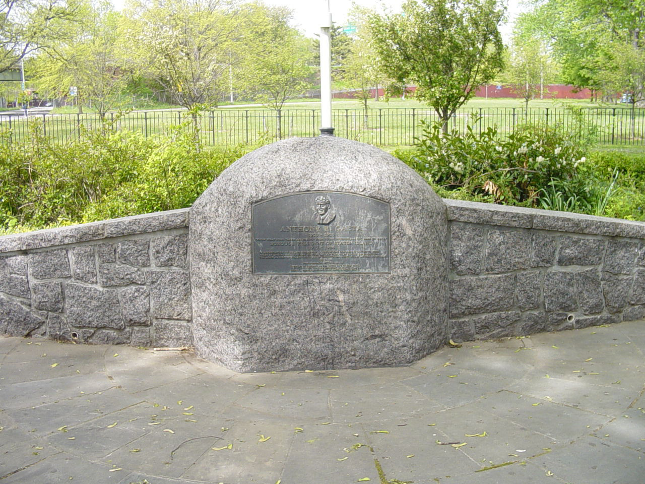 Relief plaque mounted on face of slab