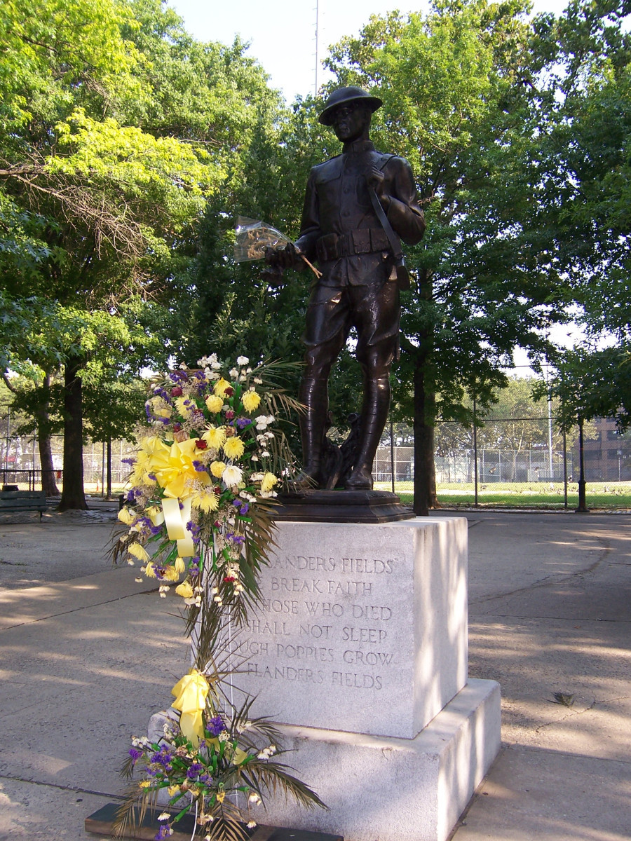 Standing figure (over life size) with integral plinth, on pedestal