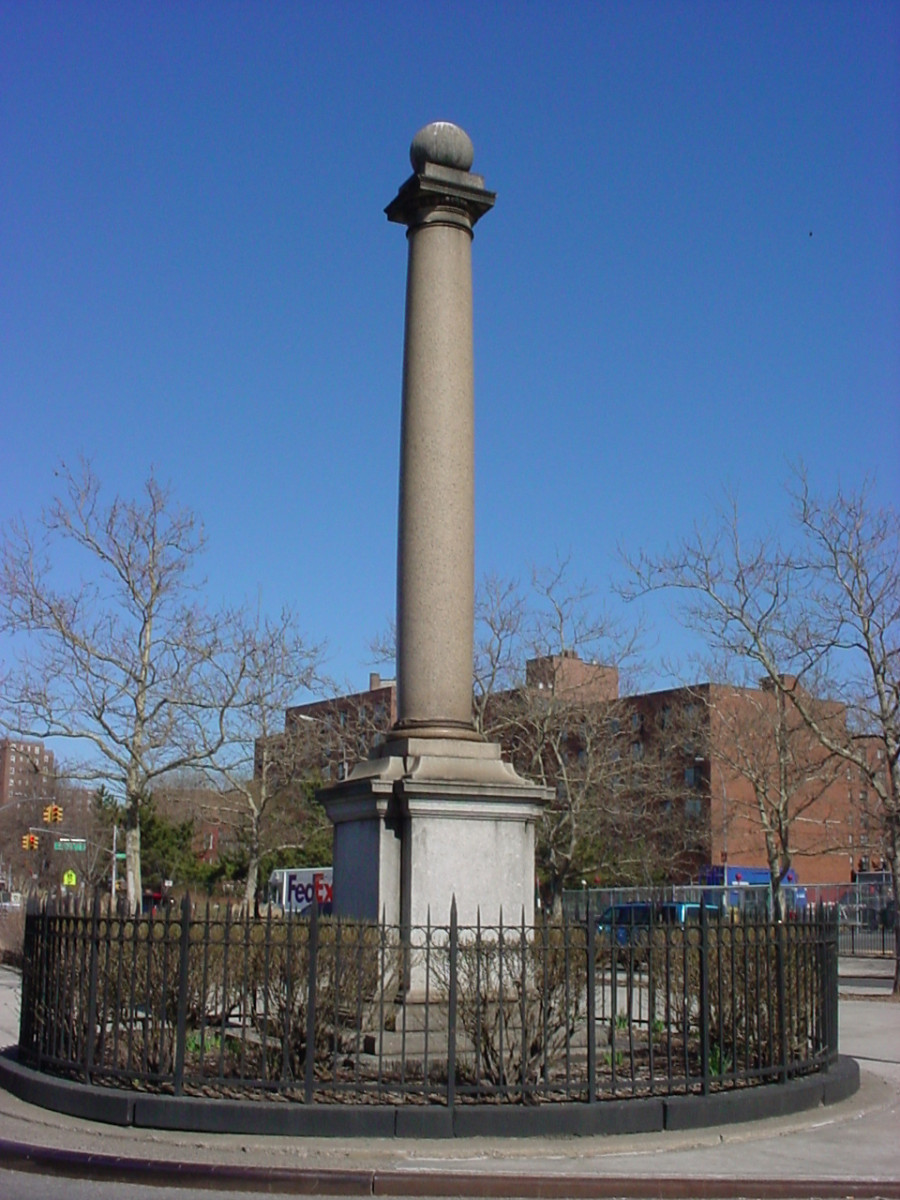 Column with a globe at the top, on a pedestal; two plaques, one with bas-relief