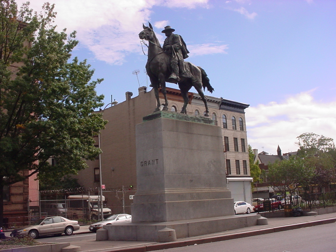 Equestrian figure on integral plinth on pedestal