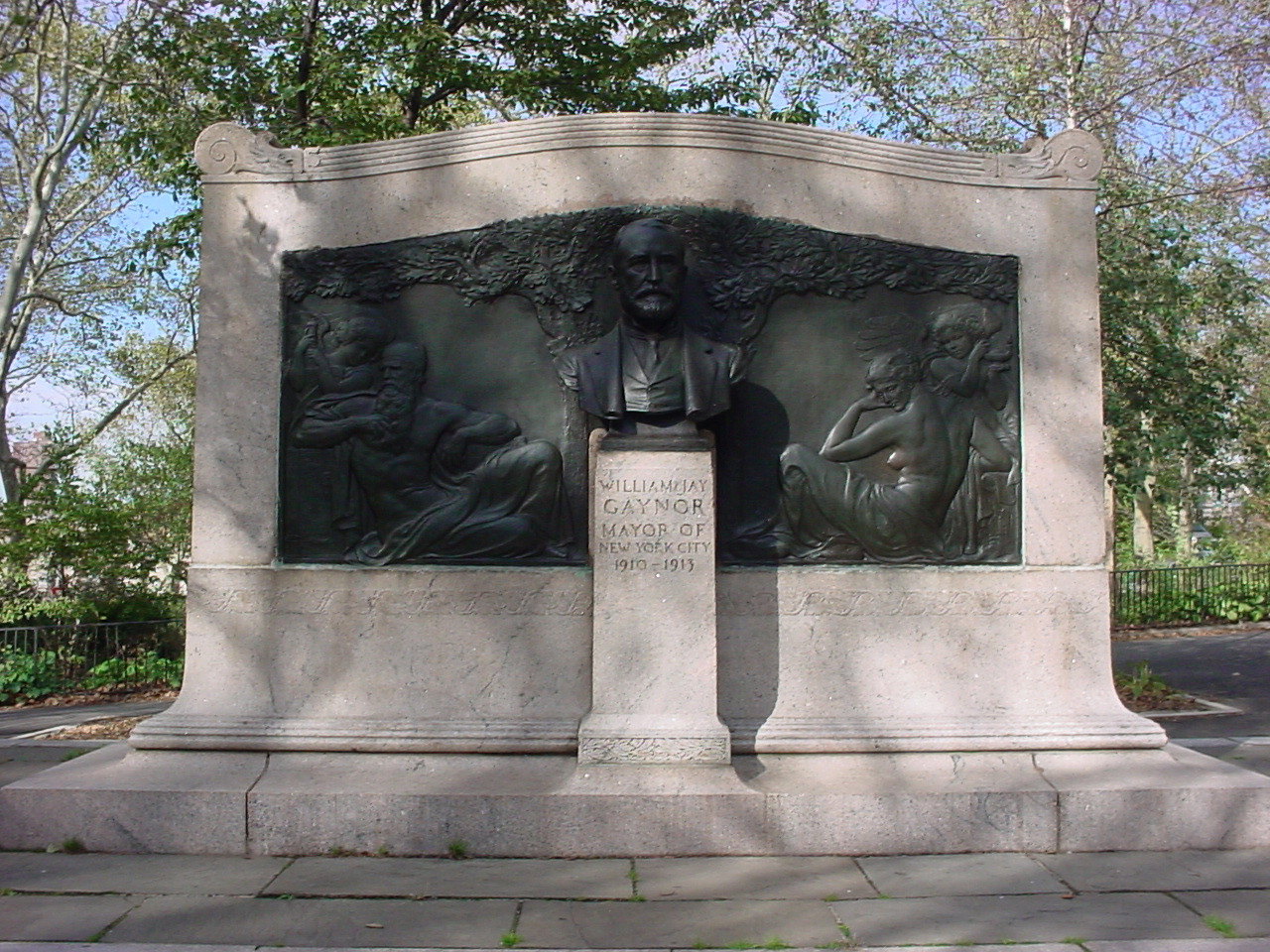 Bust on pedestal in front of a broad stele with paired bas-reliefs; stele is on a platform reached by two steps