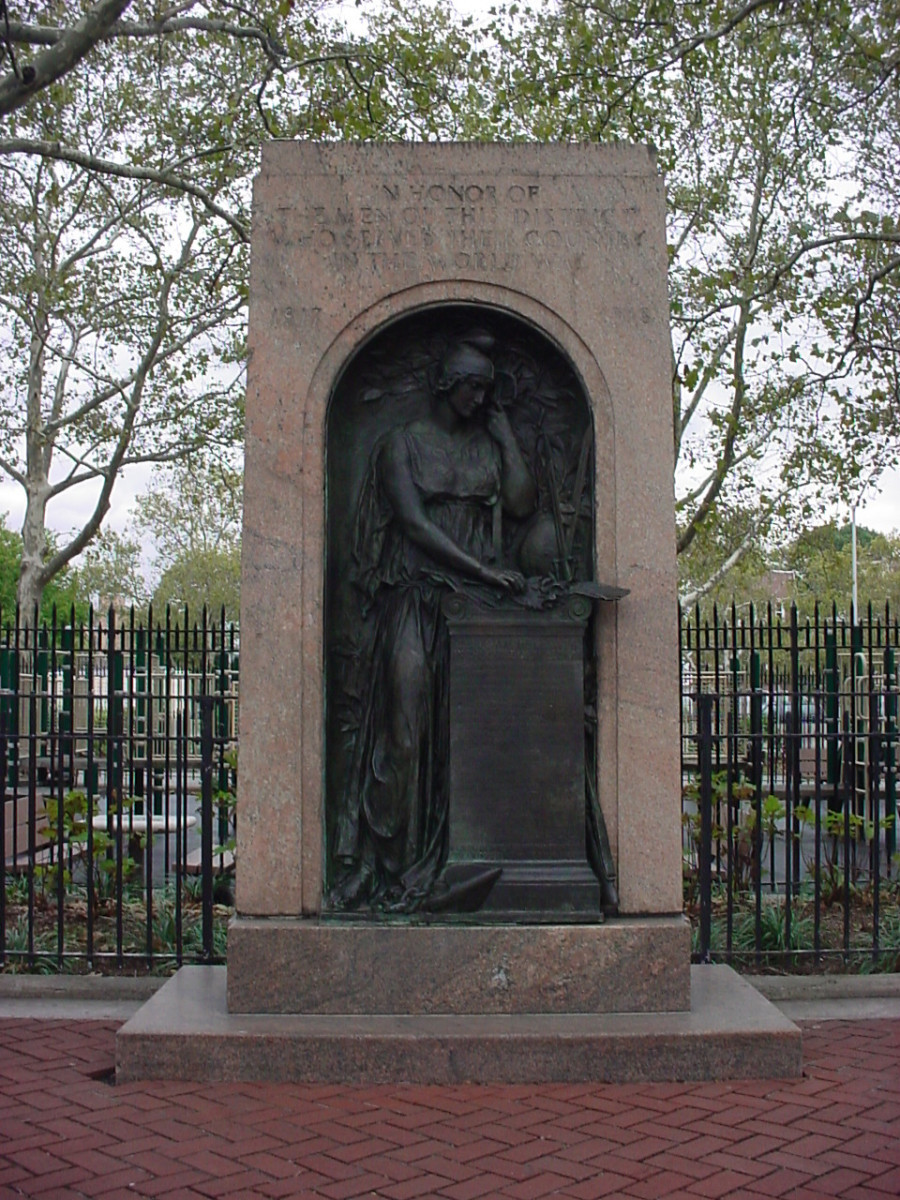 Figure (life size) in archiform high relief recessed in stele, decorated with applied wreaths on right and left sides (two in all), on base on plinth on terrace with three steps at front and bench at either end