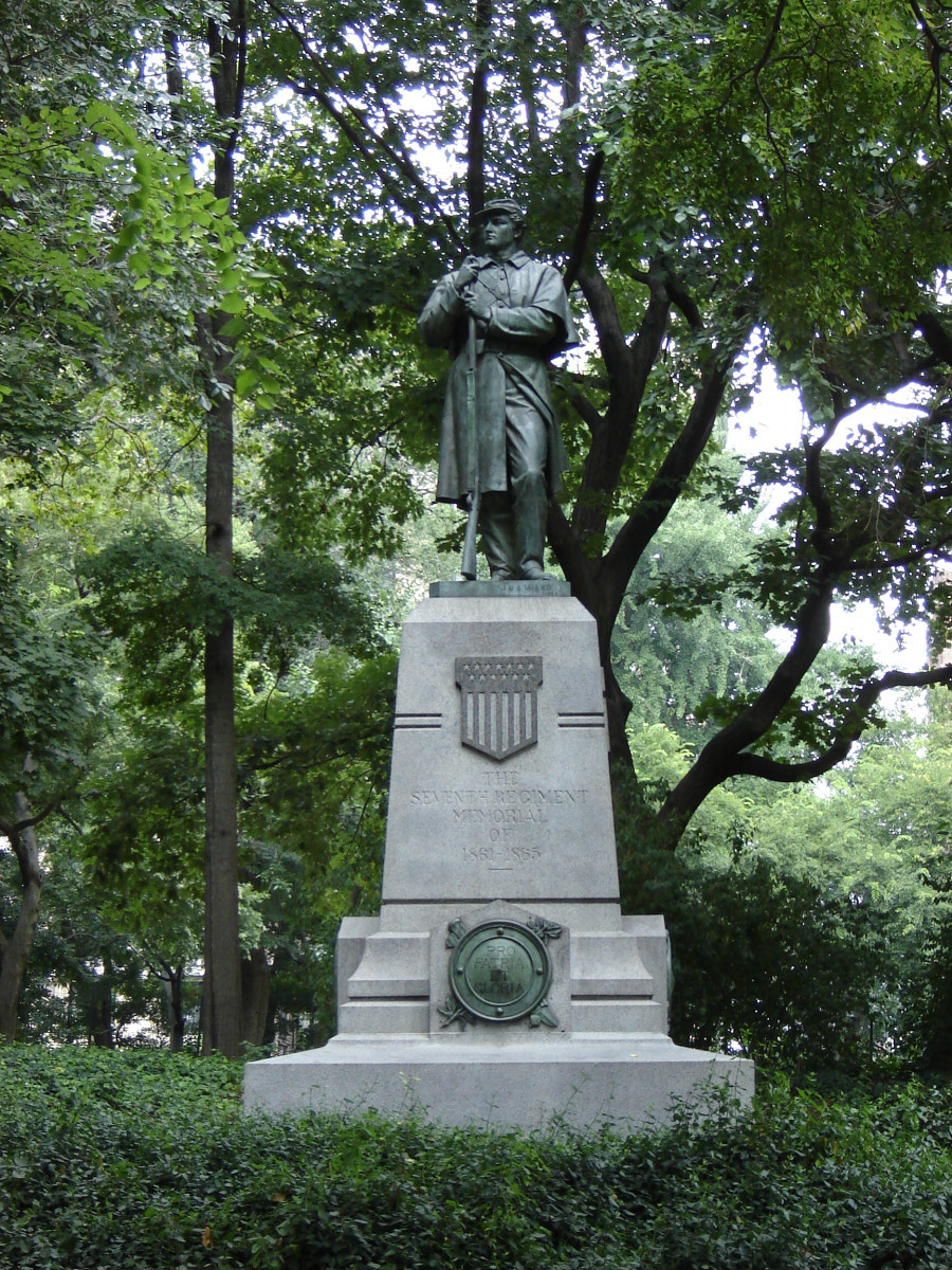 Statue on pedestal, 4 bronze roundels