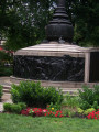 Flagstaff on drum pedestal with two bas-reliefs and two plaques