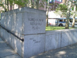 Plaza, gate with three steps and wheelchair ramp, flagstaff on base, benches