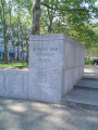 Plaza, gate with three steps and wheelchair ramp, flagstaff on base, benches