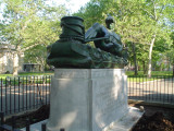 Male figure (heroic scale) tugging at a hawser with an integral plinth, on a pedestal