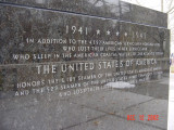 Eagle on pedestal between two ranks of four inscribed pylons (eight pylons in all; axis aligned with Statue of Liberty)